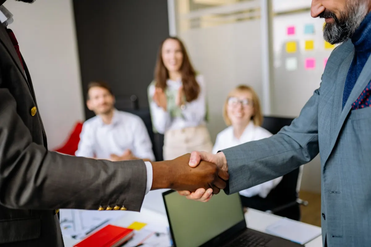 Broker shaking hands with a lending partner